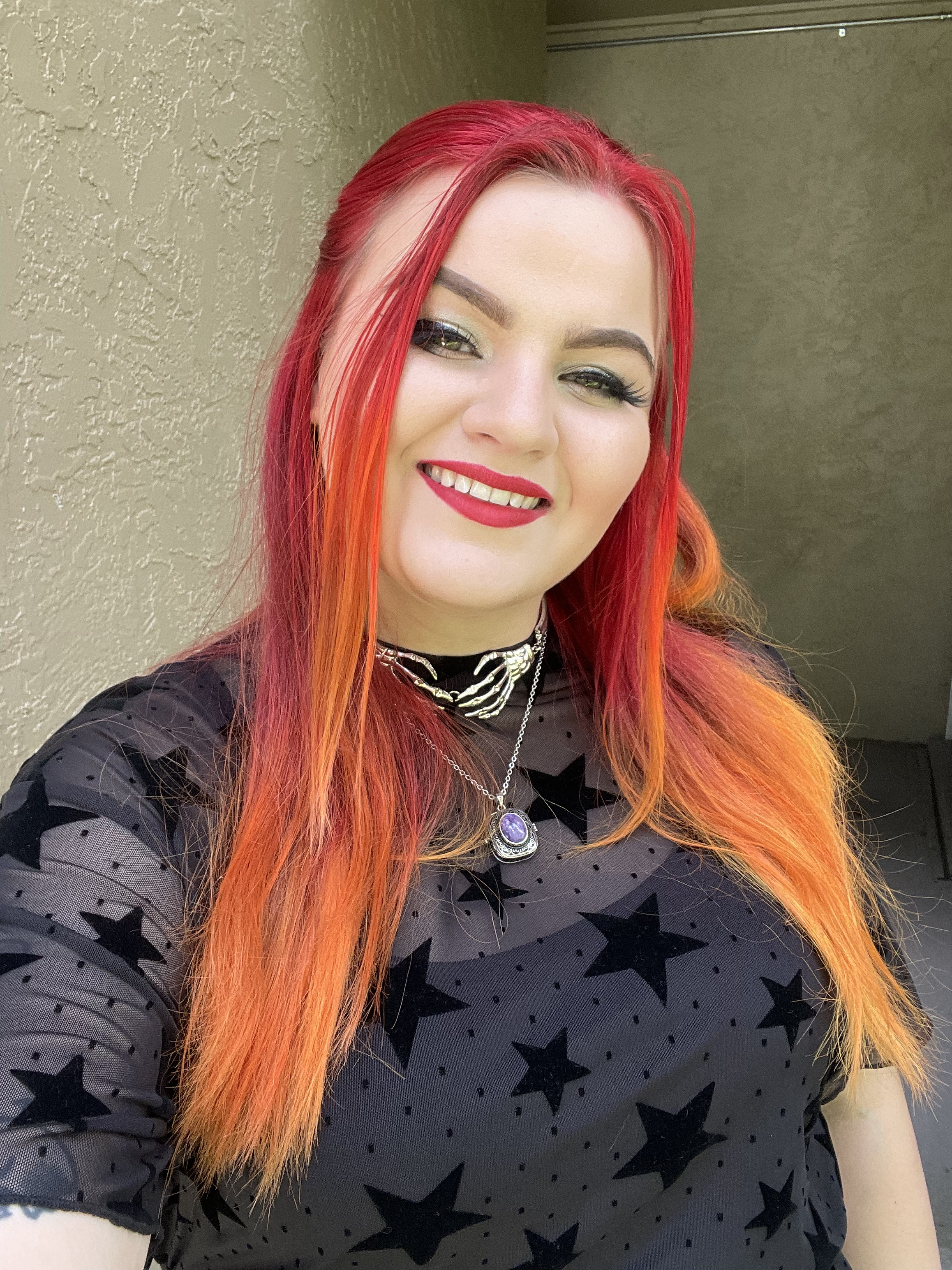 smiling white woman with red and orange hair