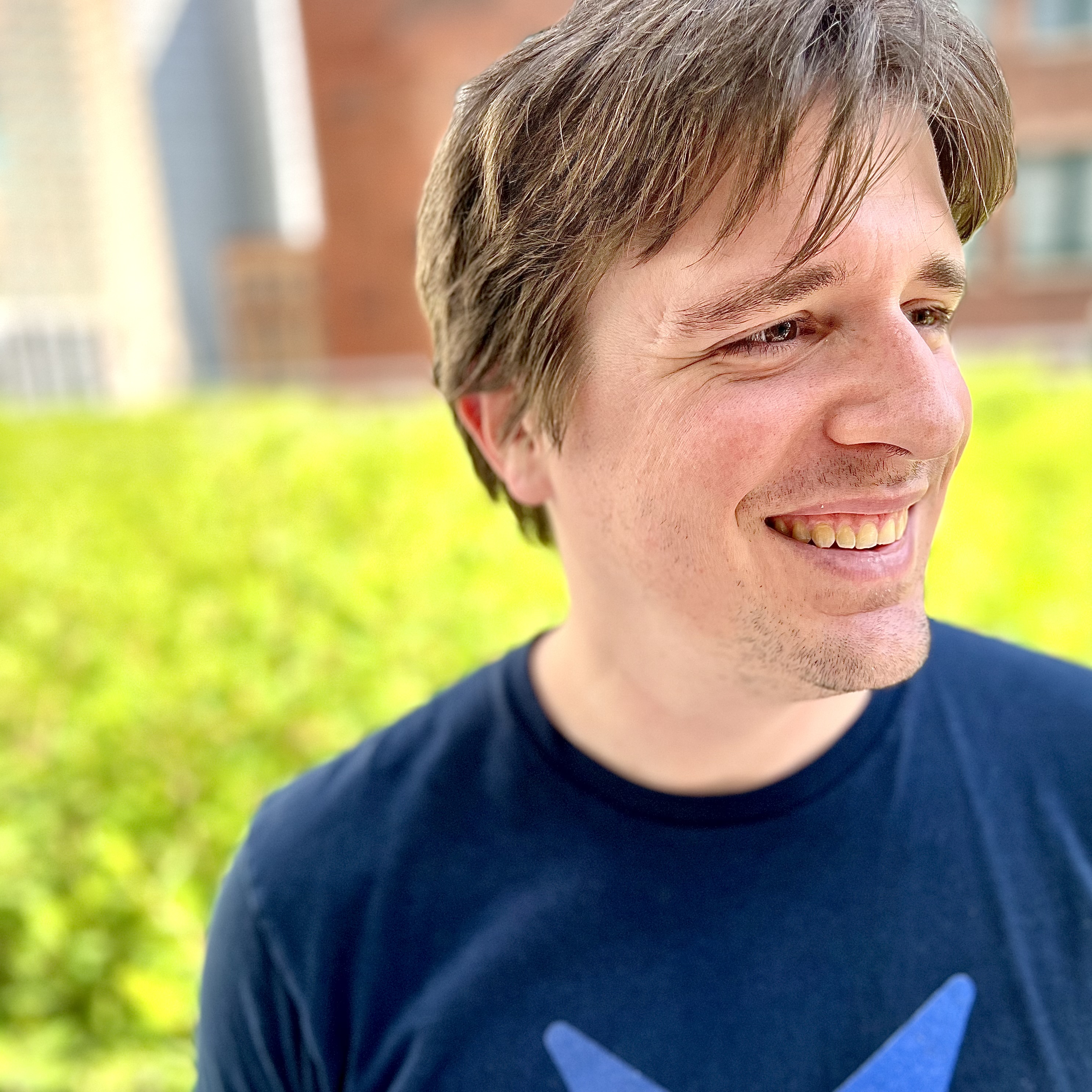Michael surrounded by soft focus greenery